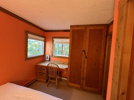 Bedroom, showing the built in desk and the tall wardrobe