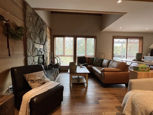 Living room looking through to the sliding doors and private deck