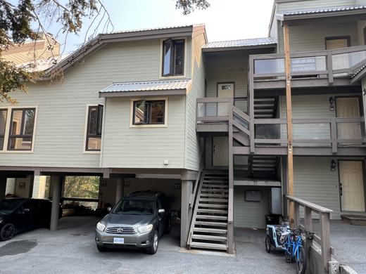 Exterior of the Smoketree building with carport parking