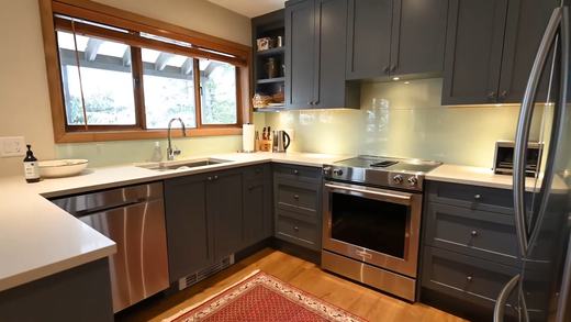 Kitchen with quartz counters, gas range and stainless appliances
